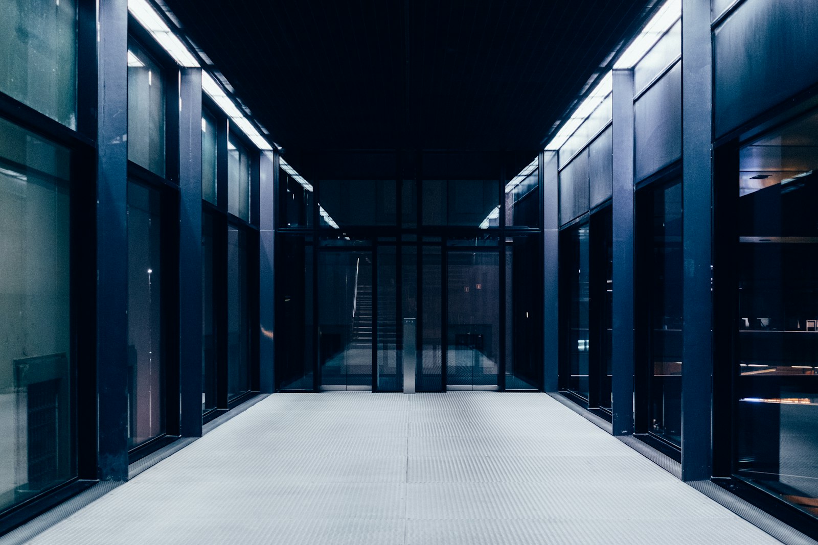 A long, empty aisle between rows of servers in a data centre